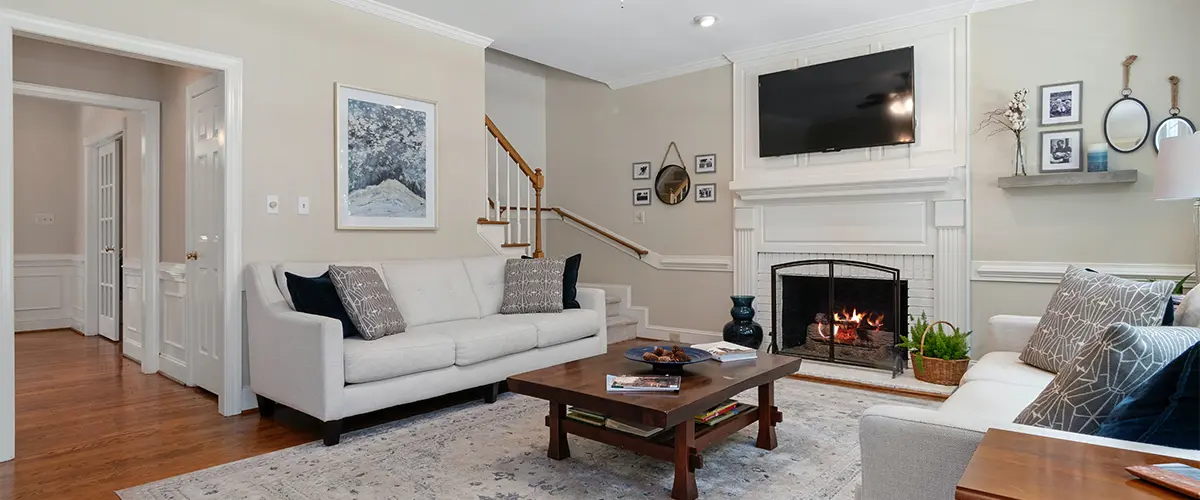 Warm, inviting living room in White Bluff, with a cozy fireplace, plush sofas, and elegant décor perfect for relaxation and gatherings.