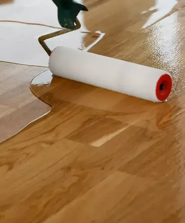 Worker with tools doing hardwood floor installation in Alpharetta, GA