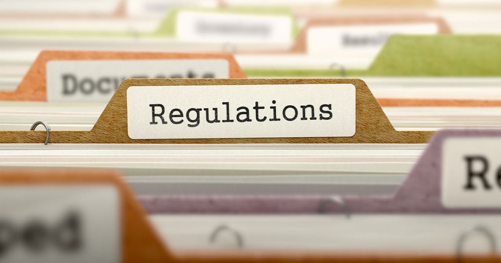 Regulations file tab in organized office records, legal compliance, business policies, and industry standards documentation